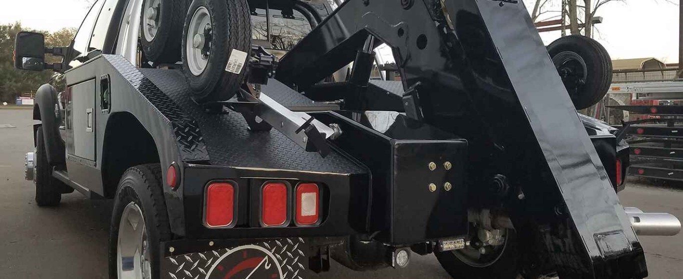 Tow truck with wheel lift ready to provide roadside assistance in Lindenhurst, NY